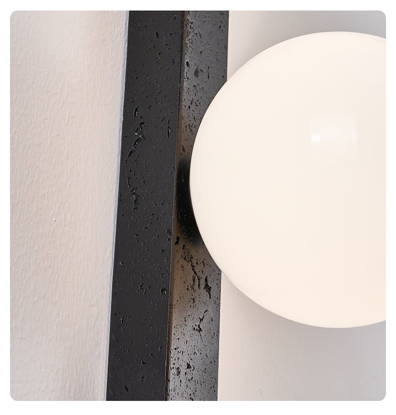 Zoshaira Globe Black Travertine Wall Sconce