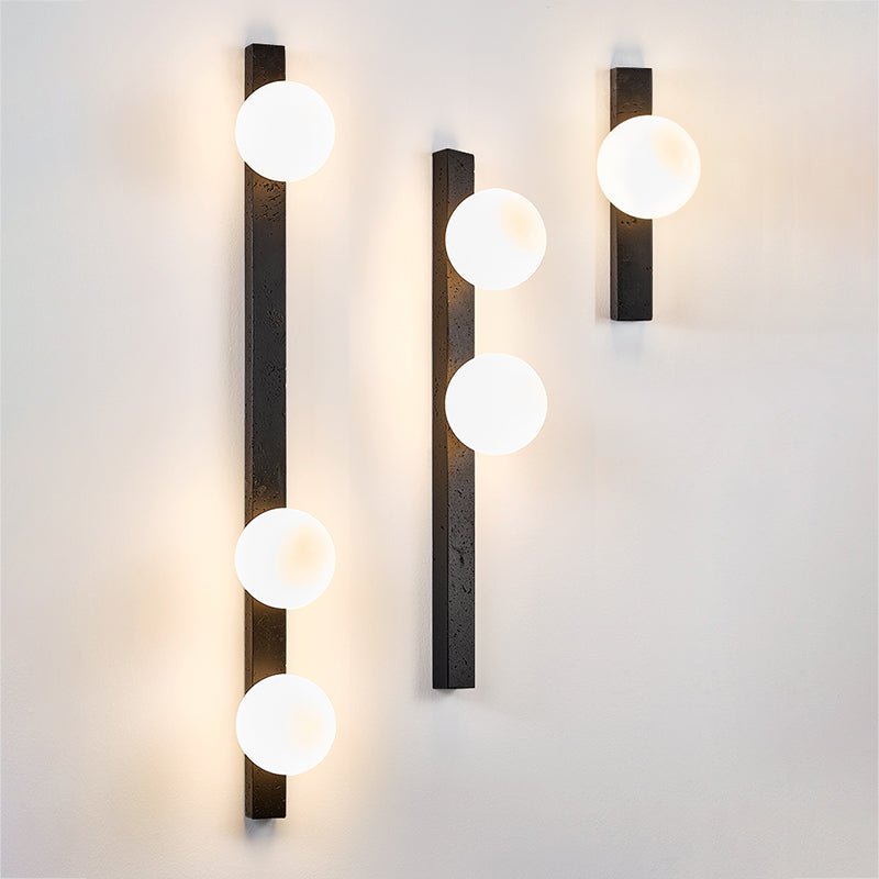 Zoshaira Globe Black Travertine Wall Sconce