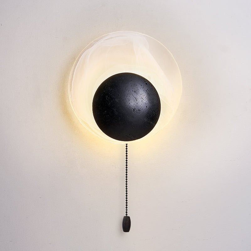 Orla Cosmica Eclipse Black Travertine Shell Wall Lamp