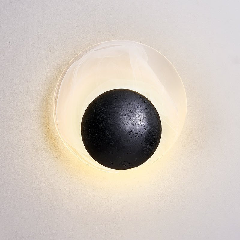 Orla Cosmica Eclipse Black Travertine Shell Wall Lamp