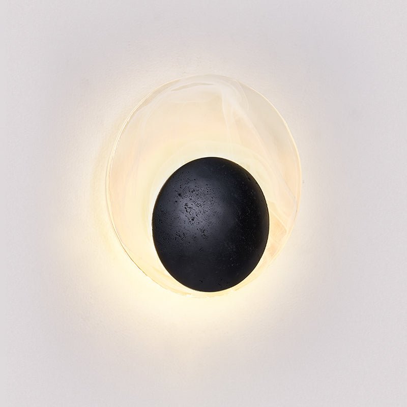 Orla Cosmica Eclipse Black Travertine Shell Wall Lamp