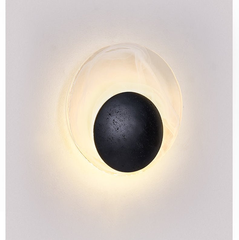 Orla Cosmica Eclipse Black Travertine Shell Wall Lamp