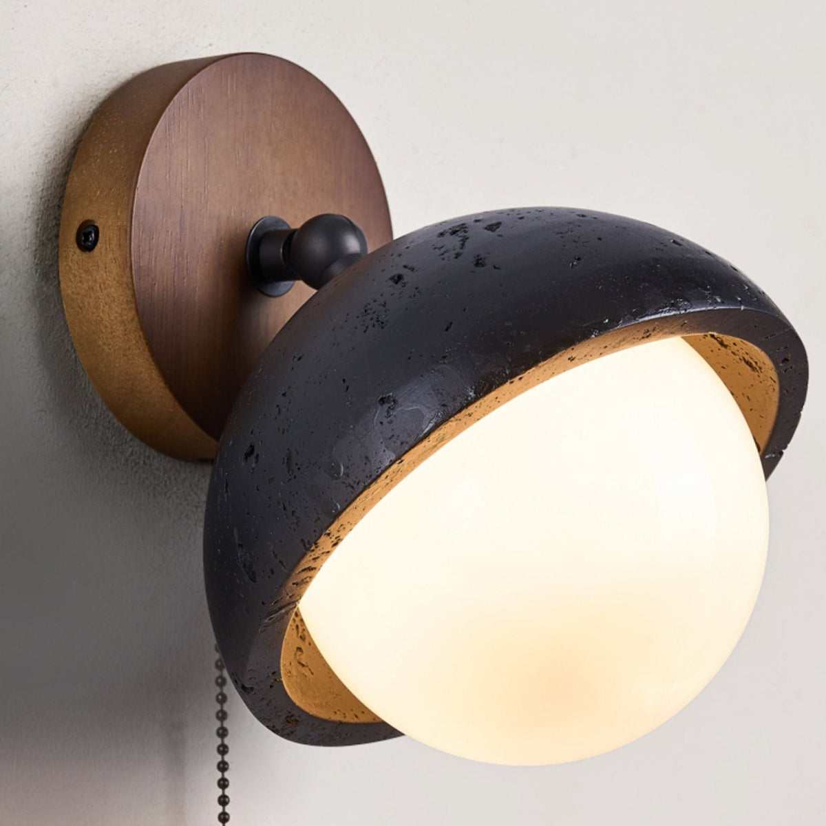 Serenaria Globe Black Travertine Pivot Sconce